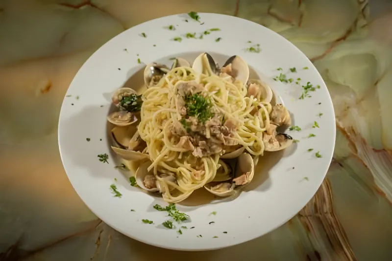 Overhead view of spaghetti with clams and parsley